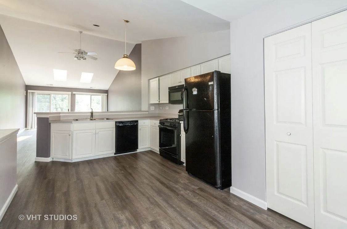 1069 Ripple Ridge Darien, IL 60561 - Photo 5 of 12 a kitchen with a refrigerator and a sink
