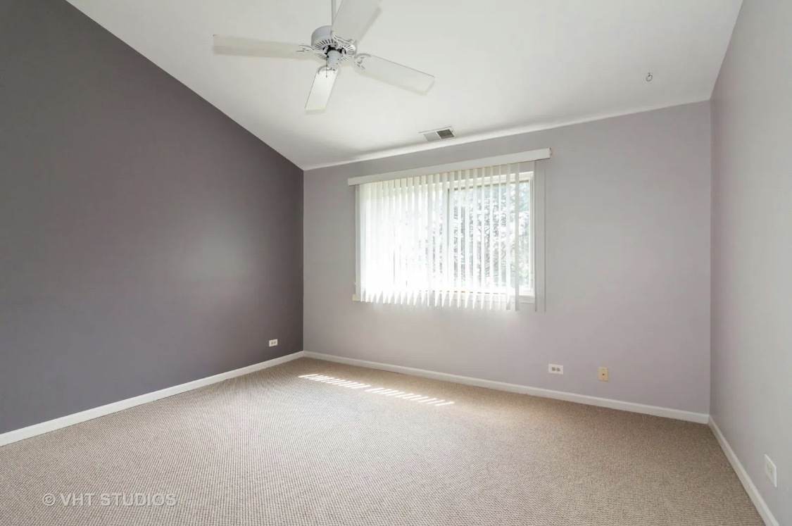 1069 Ripple Ridge Darien, IL 60561 - Photo 7 of 12 an empty room with a empty space and windows