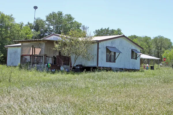 a backyard of a house with seating space