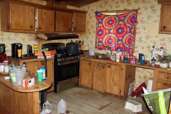 a kitchen with stainless steel appliances granite countertop a sink and cabinets