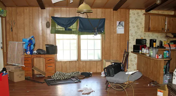 a room with wooden furniture and windows