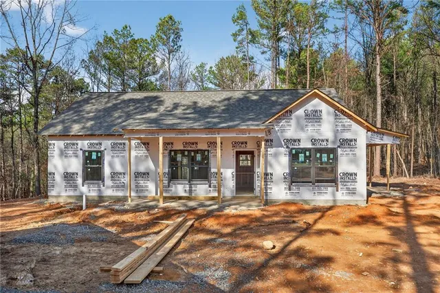 a backyard of a house with yard and outdoor seating