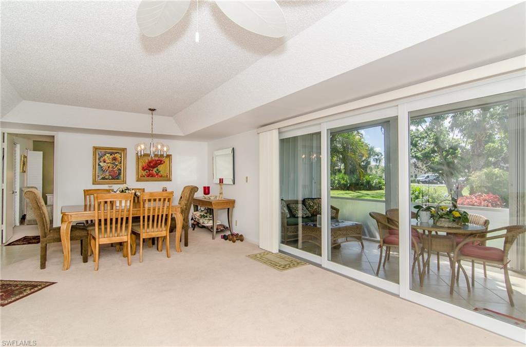 865 Teryl Road, Unit 2111 Naples, FL 34112 - Photo 1 of 21 Dining Area and sliders to Lanai