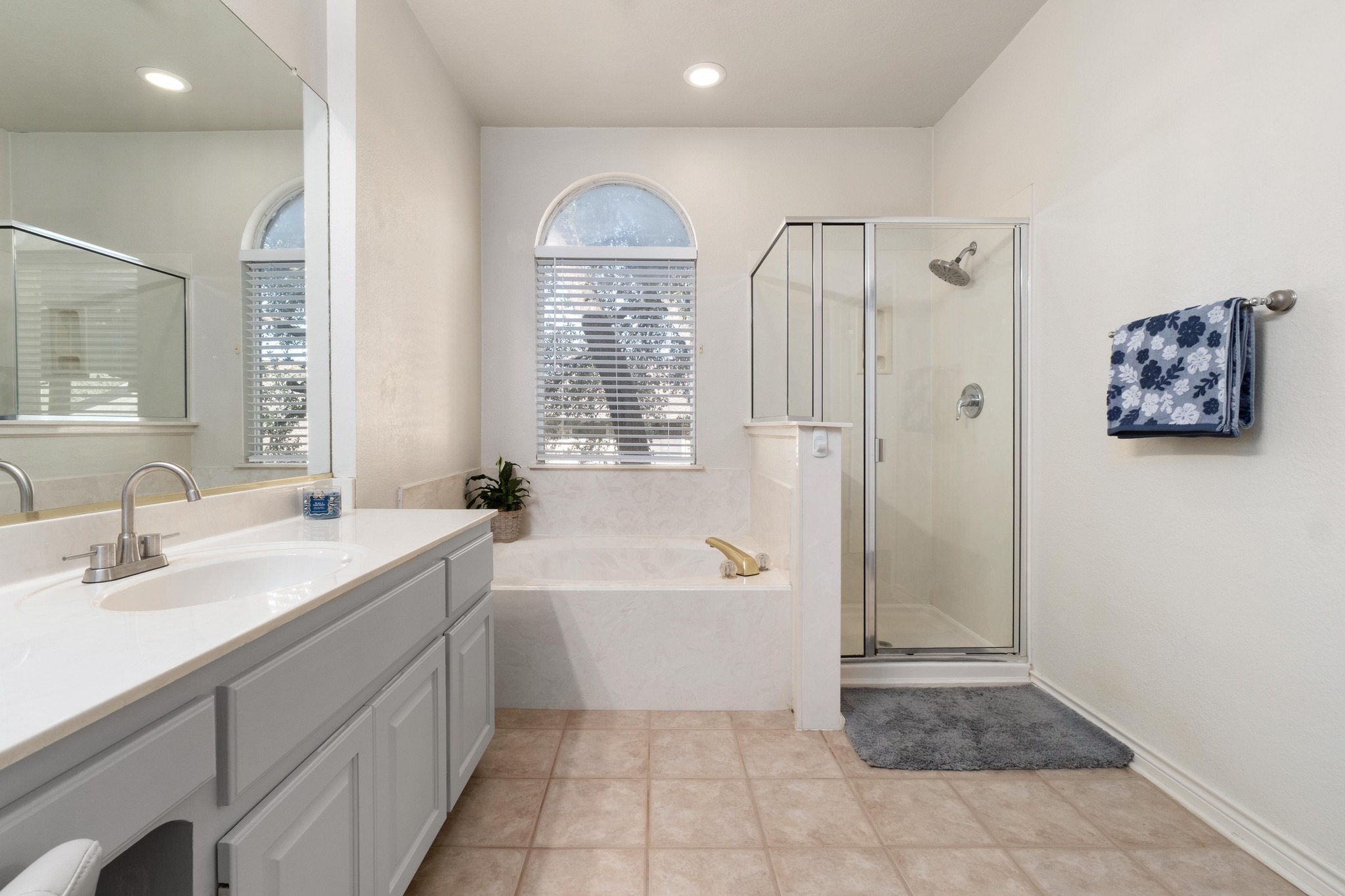 3808 Latimer Drive Austin, TX 78732 - Photo 20 of 30 a bathroom with a tub sink and mirror