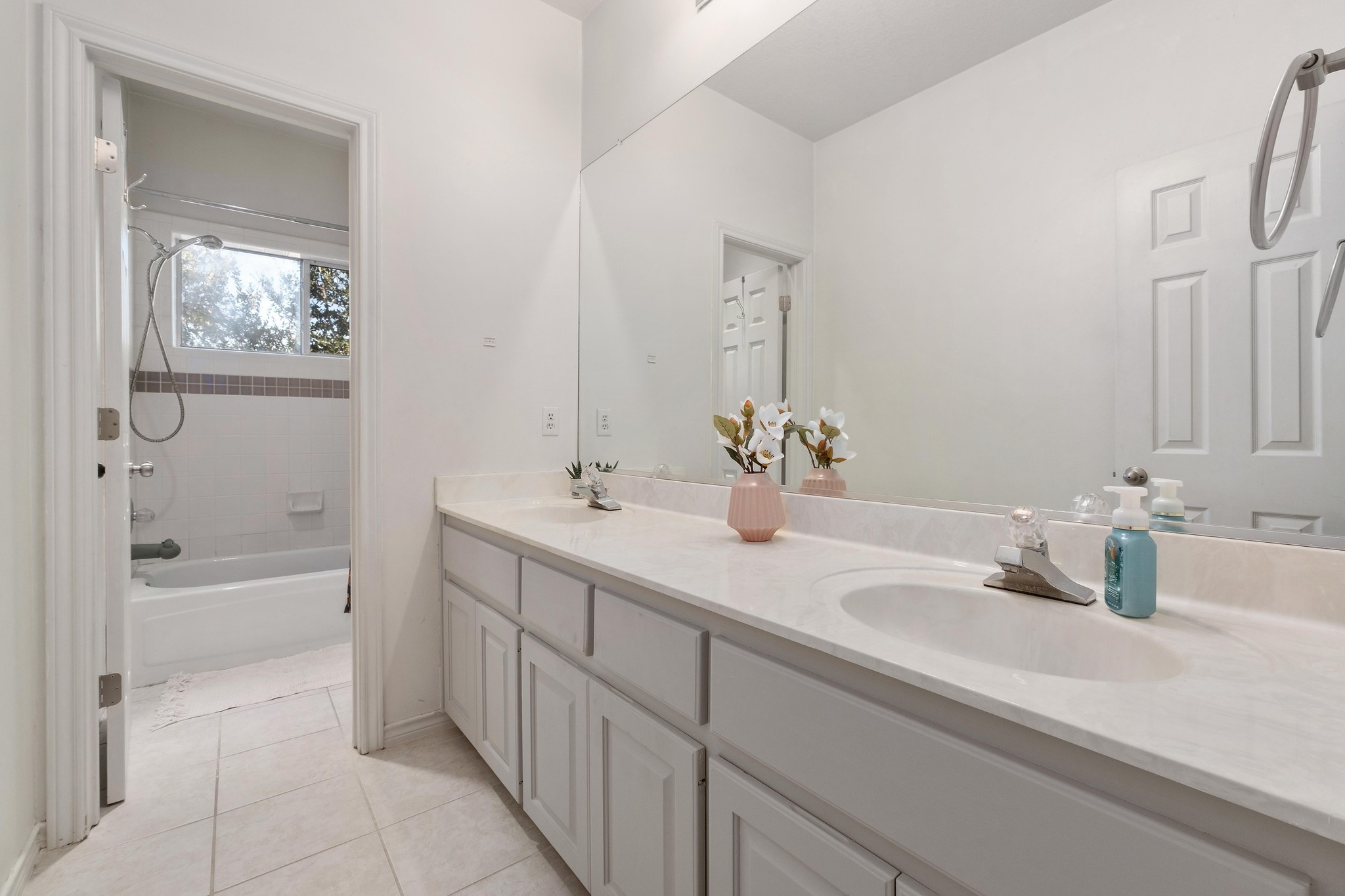 3808 Latimer Drive Austin, TX 78732 - Photo 25 of 30 a bathroom with a tub sink and mirror