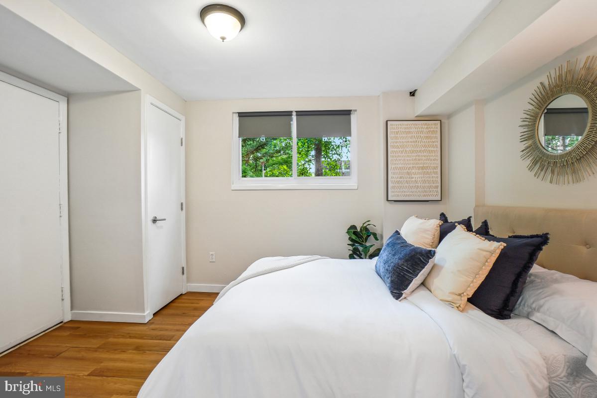 827 Caddington Avenue Silver Spring, MD 20901 - Photo 35 of 45 a bedroom with a bed and a window