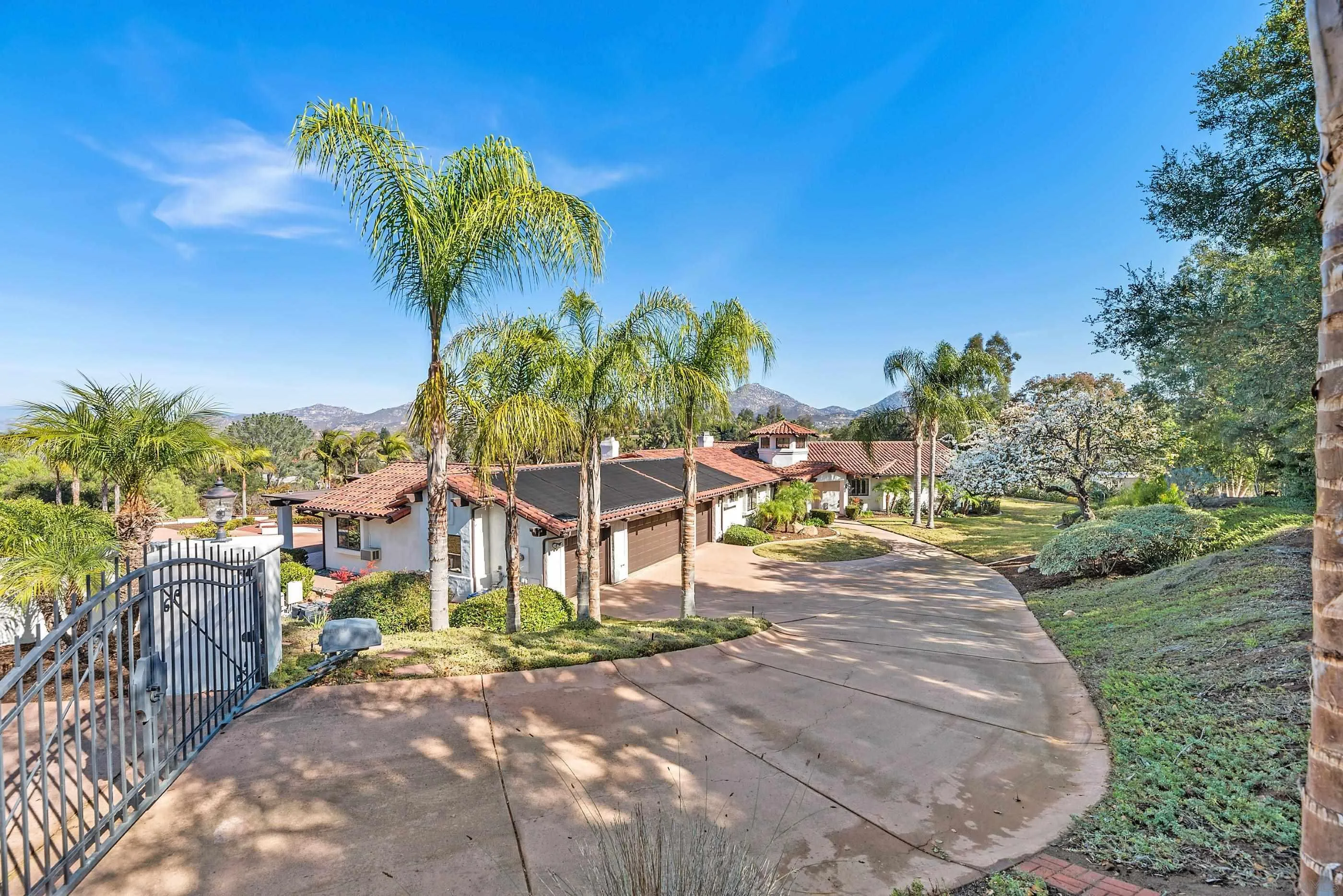 15641 Boulder Mountain Road Poway, CA 92064 - Photo 4 of 75 a view of a garden with a bench