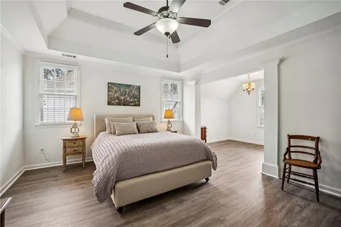 a view of a yard with table and chairs under an umbrella
