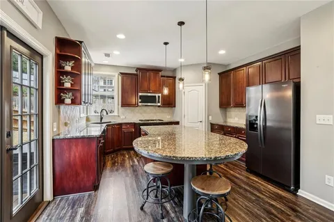 a view of a livingroom with furniture and a floor to ceiling window