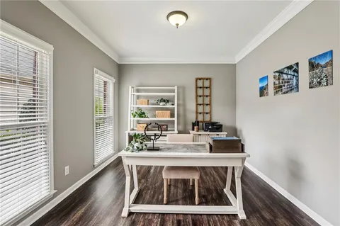 a view of a dining room with furniture wooden floor and chandelier