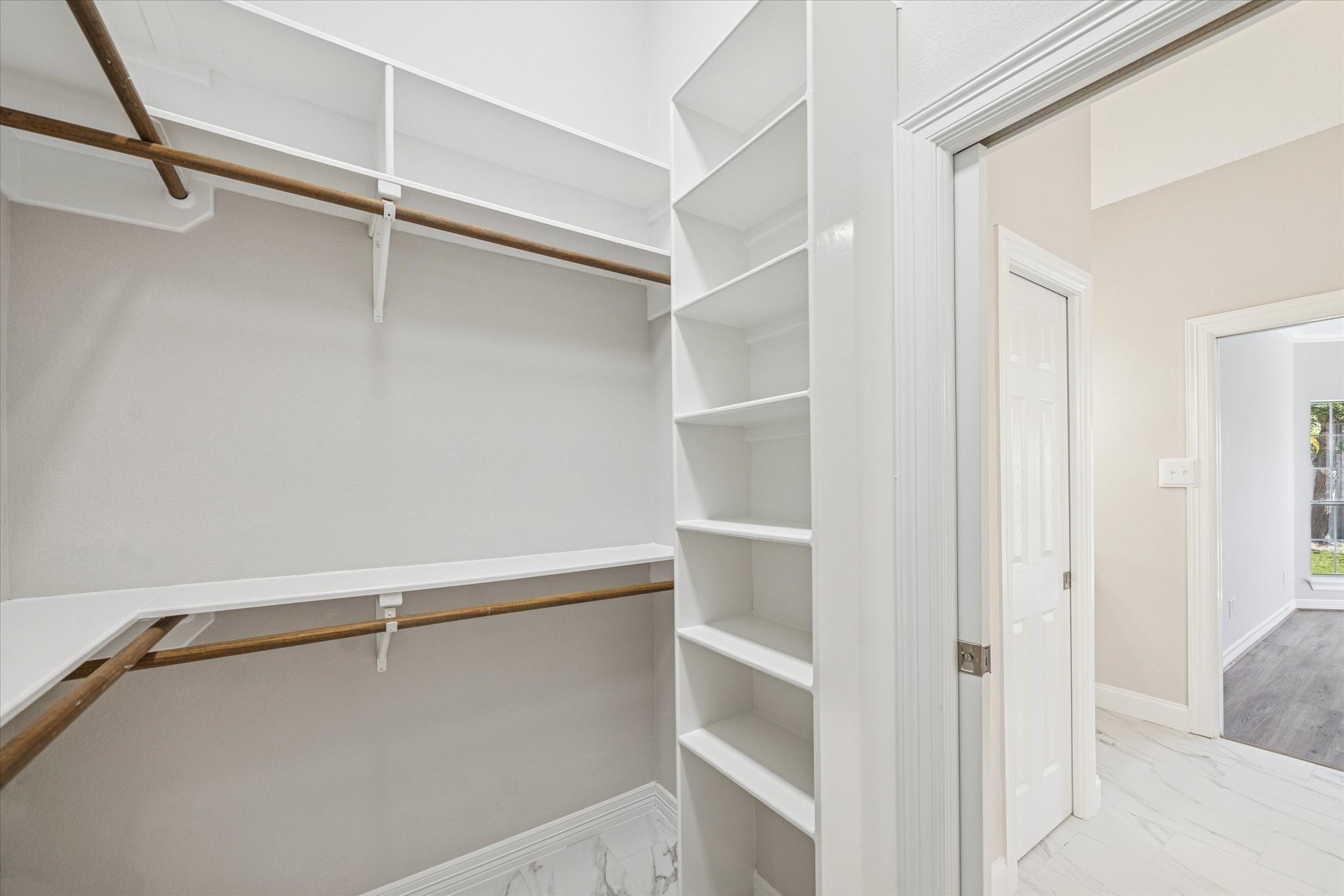 5437 Edgewater Court Willis, TX 77318 - Photo 17 of 29 a view of an empty walk in closet