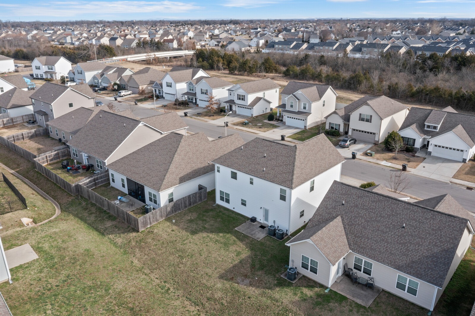 1932 Secretariat Trace Murfreesboro, TN 37128 - Photo 44 of 51 an aerial view of a house with a yard and mountain view in back