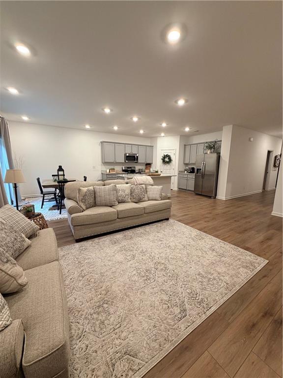 117 Red Maple Way Adairsville, GA 30103 - Photo 11 of 44 a living room with furniture and a wooden floor