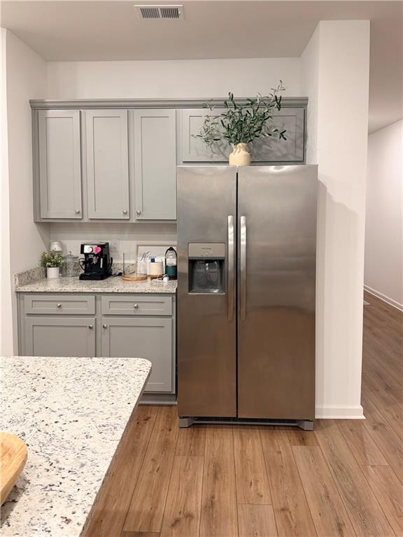 117 Red Maple Way Adairsville, GA 30103 - Photo 17 of 44 a kitchen with stainless steel appliances granite countertop a refrigerator sink and cabinets