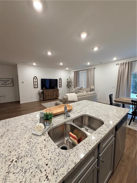 117 Red Maple Way Adairsville, GA 30103 - Photo 19 of 44 a kitchen with a sink and a stove top oven with wooden floor