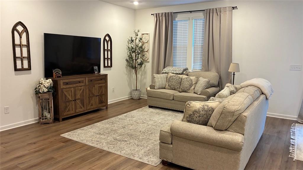 117 Red Maple Way Adairsville, GA 30103 - Photo 9 of 44 a living room with furniture and a flat screen tv