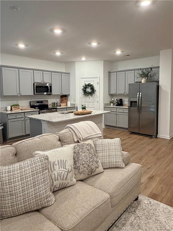 117 Red Maple Way Adairsville, GA 30103 - Photo 10 of 44 a living room with furniture kitchen and a refrigerator
