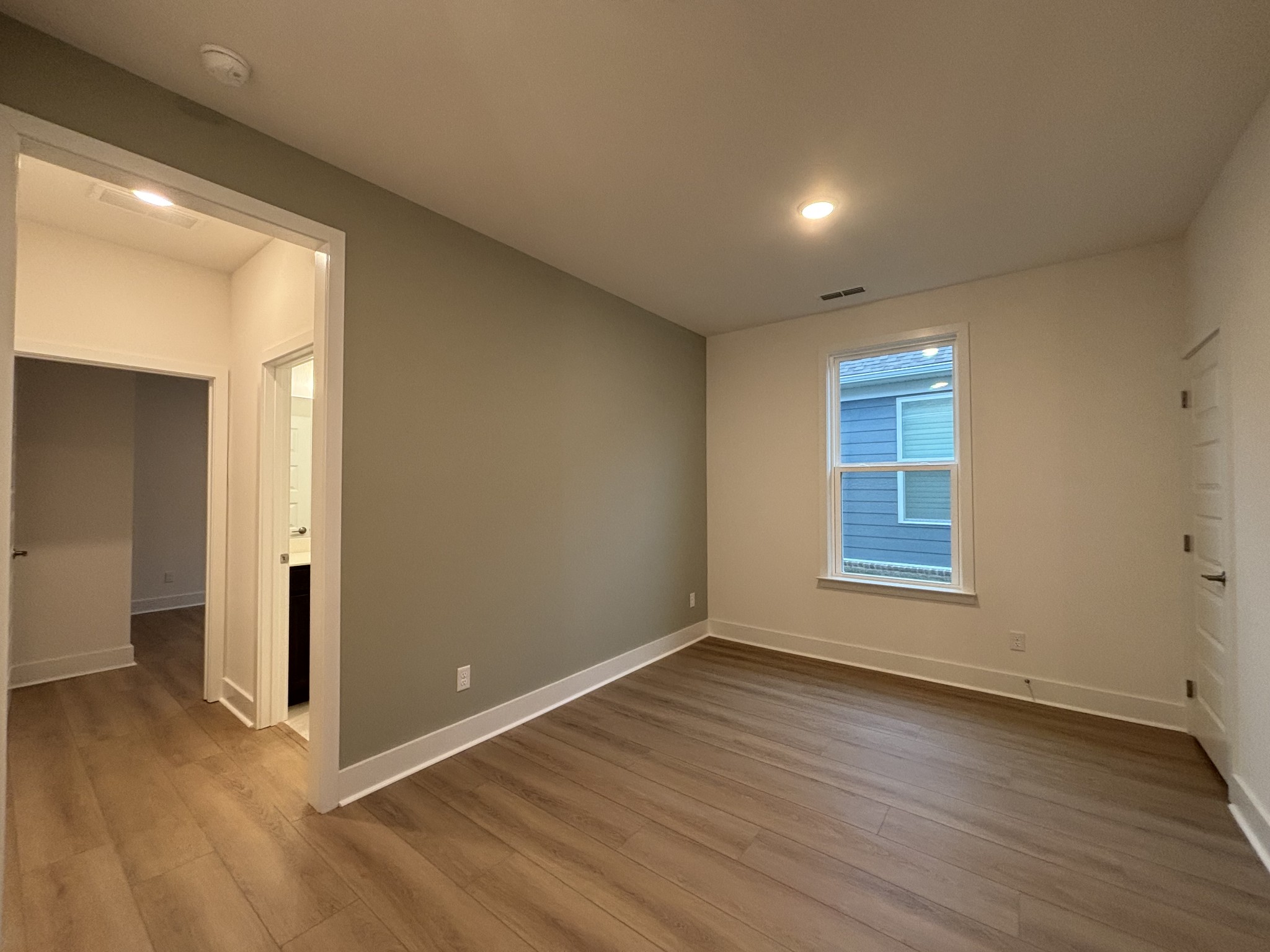531 Scarlet Oak Road Lebanon, TN 37090 - Photo 11 of 42 a view of an empty room with wooden floor and a window