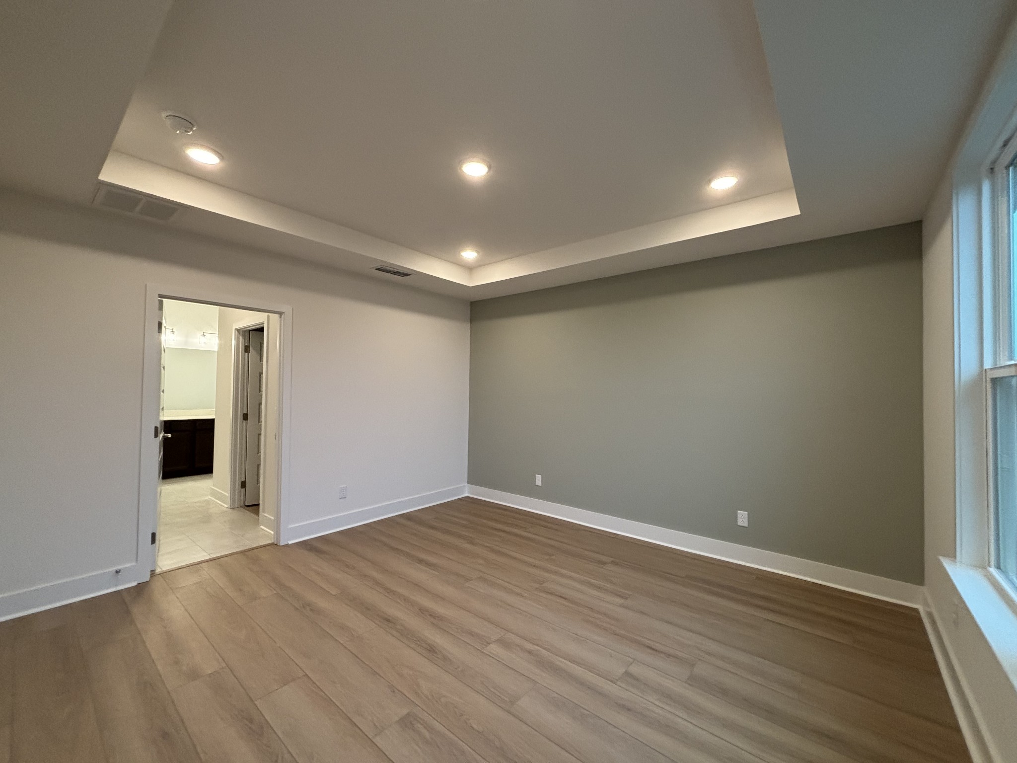 531 Scarlet Oak Road Lebanon, TN 37090 - Photo 12 of 42 an empty room with wooden floor and windows