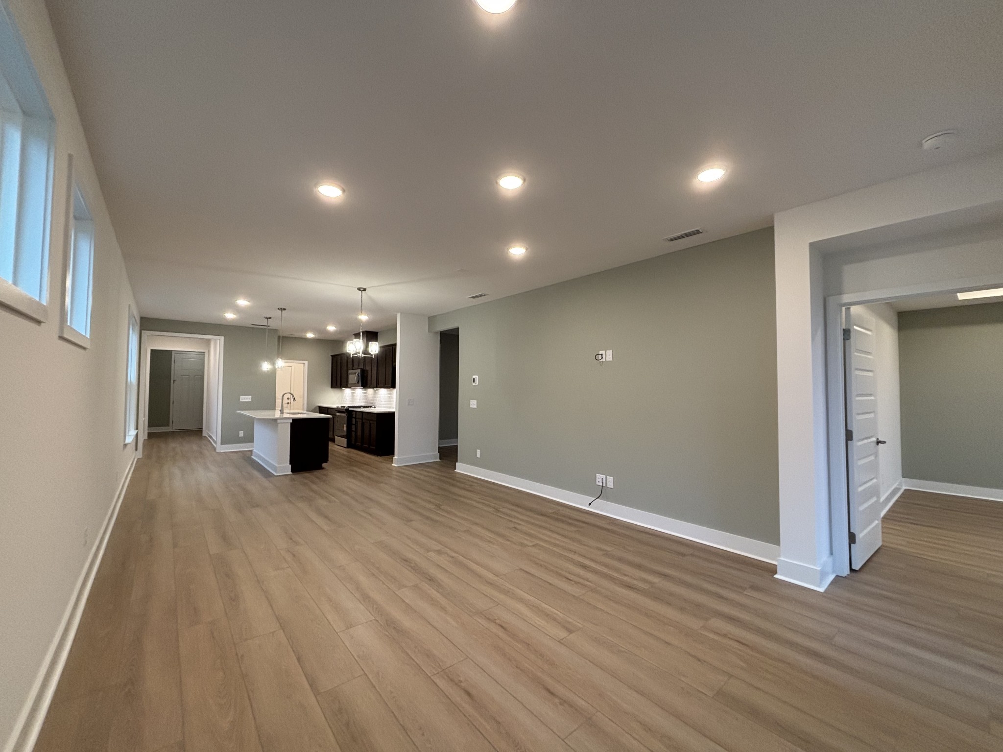 531 Scarlet Oak Road Lebanon, TN 37090 - Photo 9 of 42 a view of a big room with wooden floor and windows