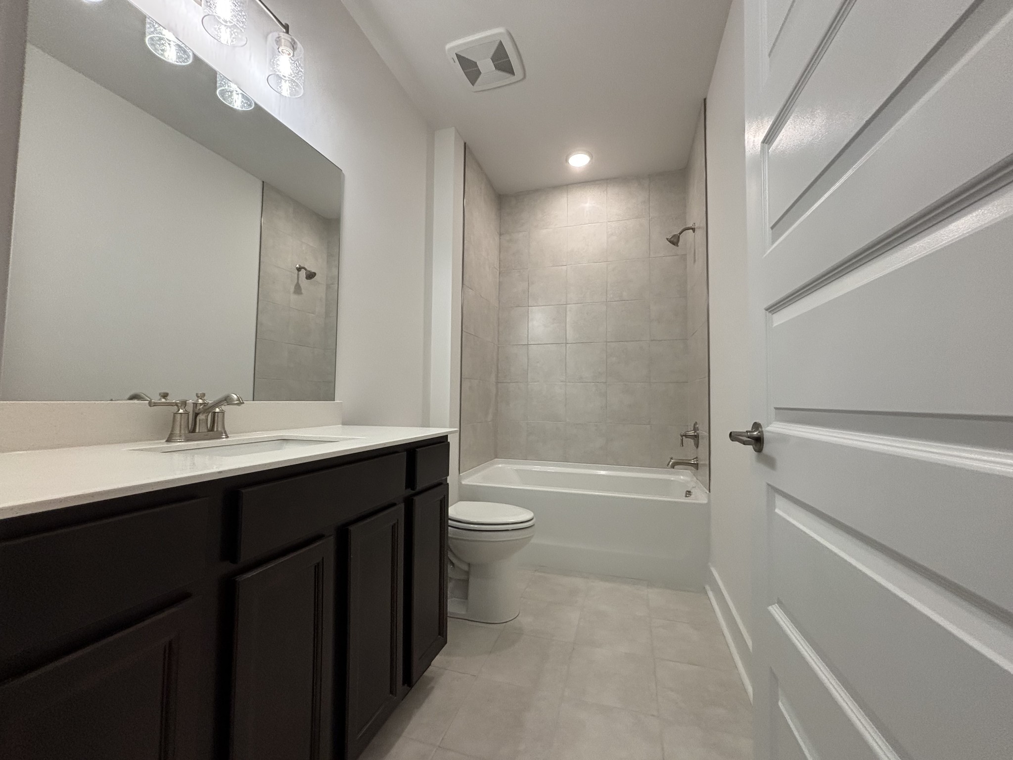 531 Scarlet Oak Road Lebanon, TN 37090 - Photo 10 of 42 a bathroom with a bathtub shower sink vanity mirror and toilet