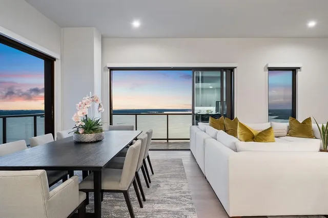 a living room with fireplace furniture and a wooden floor