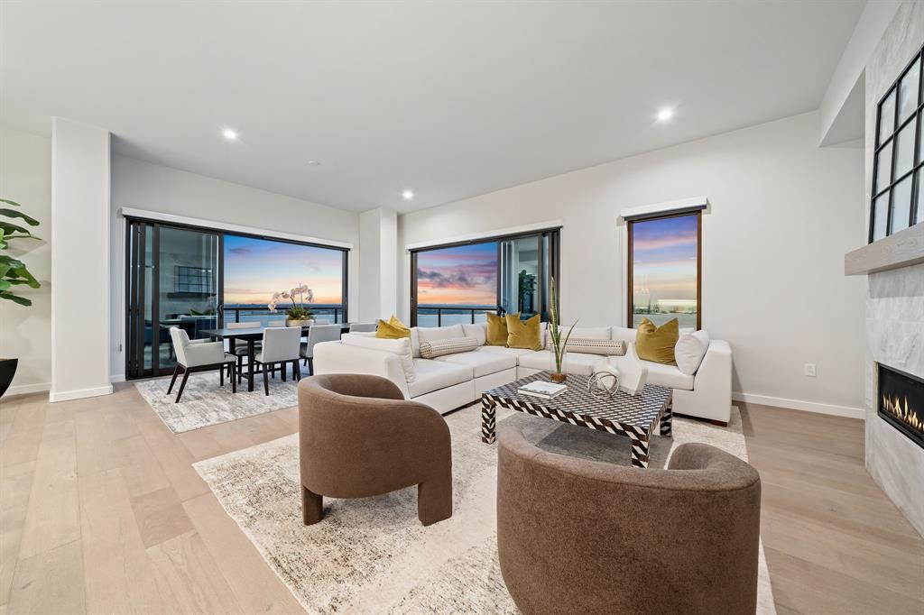 3111 Sunset Boulevard, Unit 1600 Flower Mound, TX 75022 - Photo 12 of 36 a living room with fireplace furniture and a wooden floor