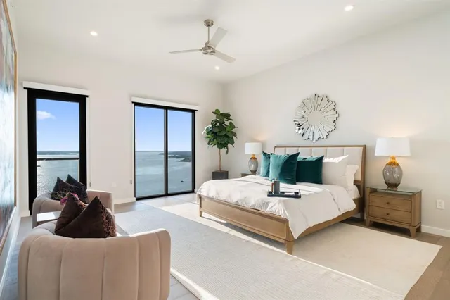 a bedroom with a bed and a potted plant