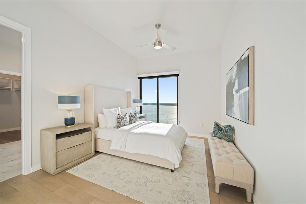 3111 Sunset Boulevard, Unit 1600 Flower Mound, TX 75022 - Photo 15 of 36 a bedroom with a bed and a large mirror