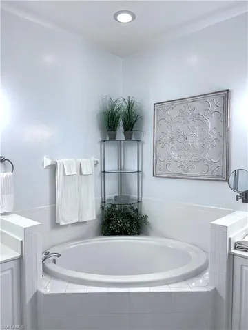 a bathroom with a bathtub and a sink