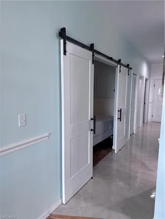 a bathroom with a shower and a glass door