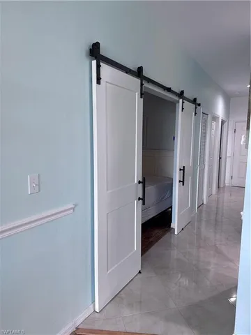 a bathroom with a shower and a glass door
