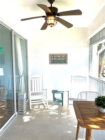 a dining room with furniture and a window