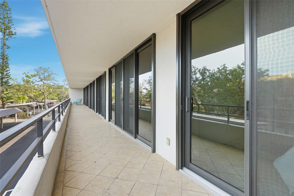 6415 Midnight Pass Road, Unit 211 Sarasota, FL 34242 - Photo 11 of 58 a view of a balcony