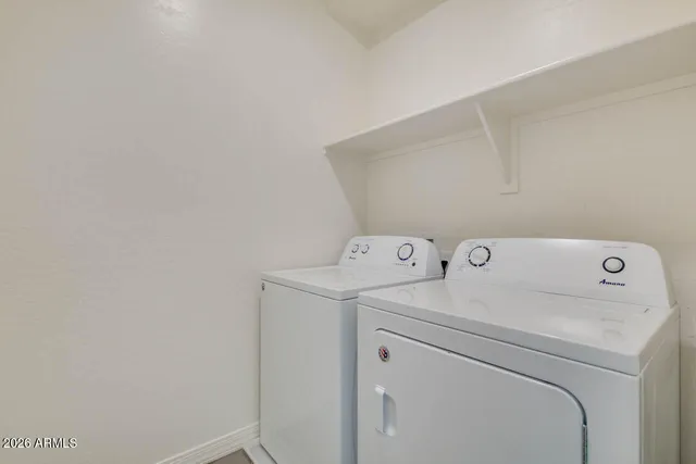a utility room with dryer and washer