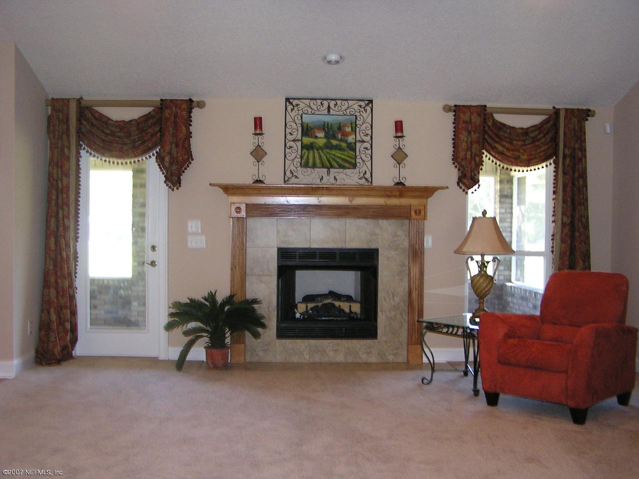 831 Halsema Road North Jacksonville, FL 32220 - Photo 5 of 19 Tile fireplace