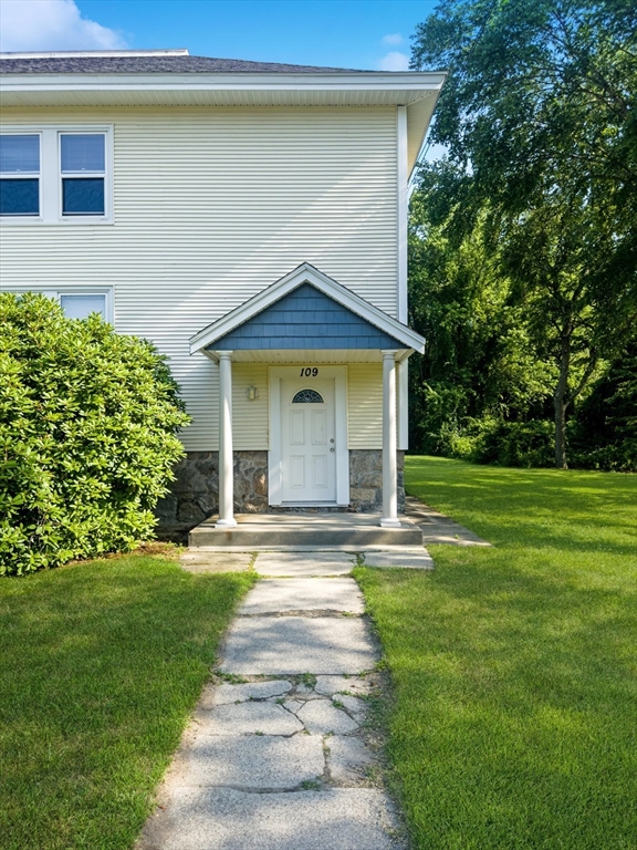 a front view of a house with a yard