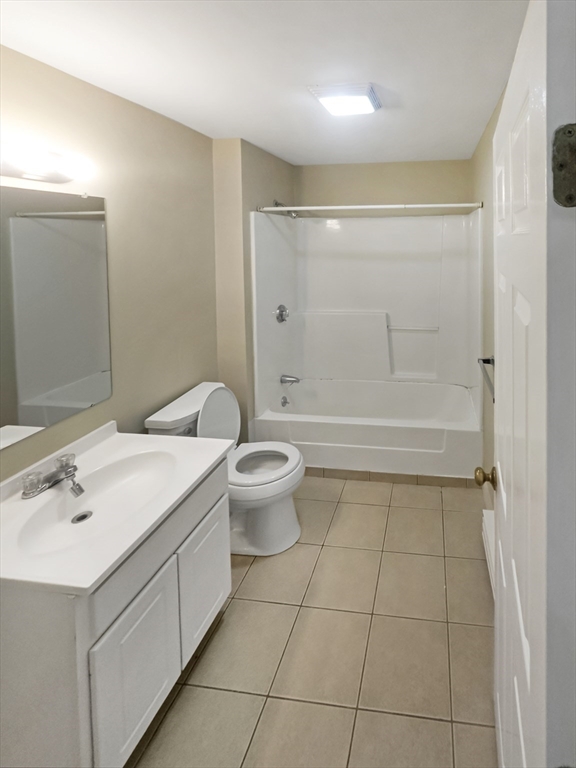 109 Hampshire Road, Unit 2 Methuen, MA 01844 - Photo 16 of 29 a bathroom with a sink a toilet and shower