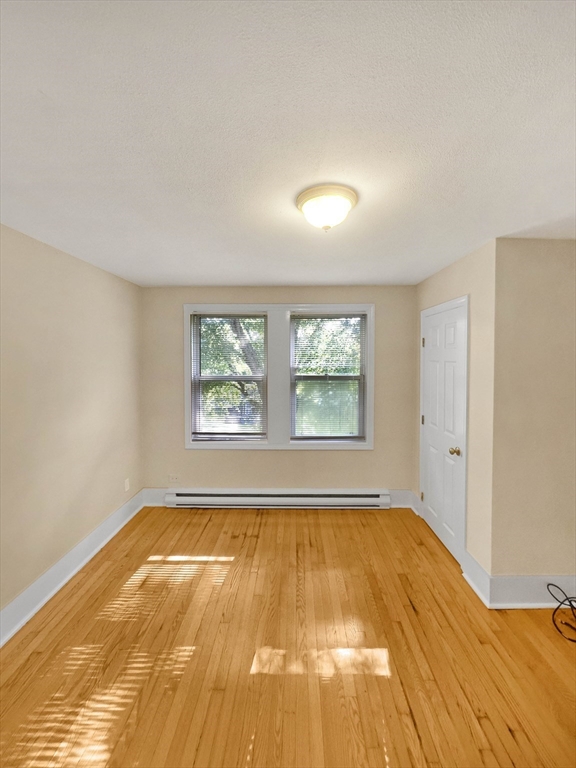109 Hampshire Road, Unit 2 Methuen, MA 01844 - Photo 19 of 29 a view of empty room with wooden floor and fan