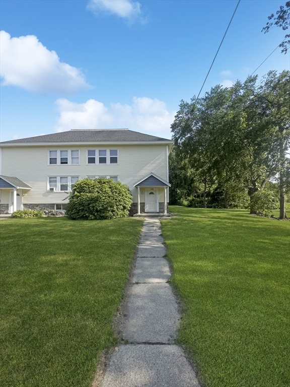 109 Hampshire Road, Unit 2 Methuen, MA 01844 - Photo 2 of 29 a front view of a house with garden