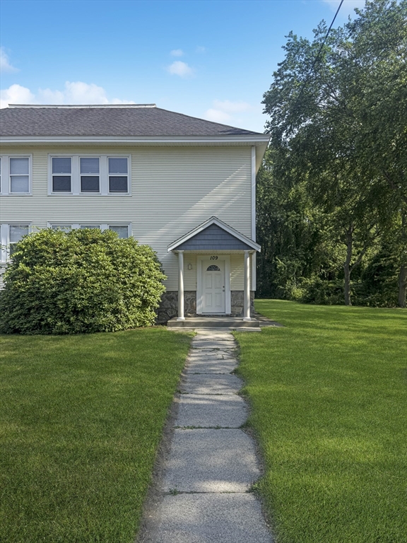 109 Hampshire Road, Unit 2 Methuen, MA 01844 - Photo 27 of 29 a front view of a house with a garden