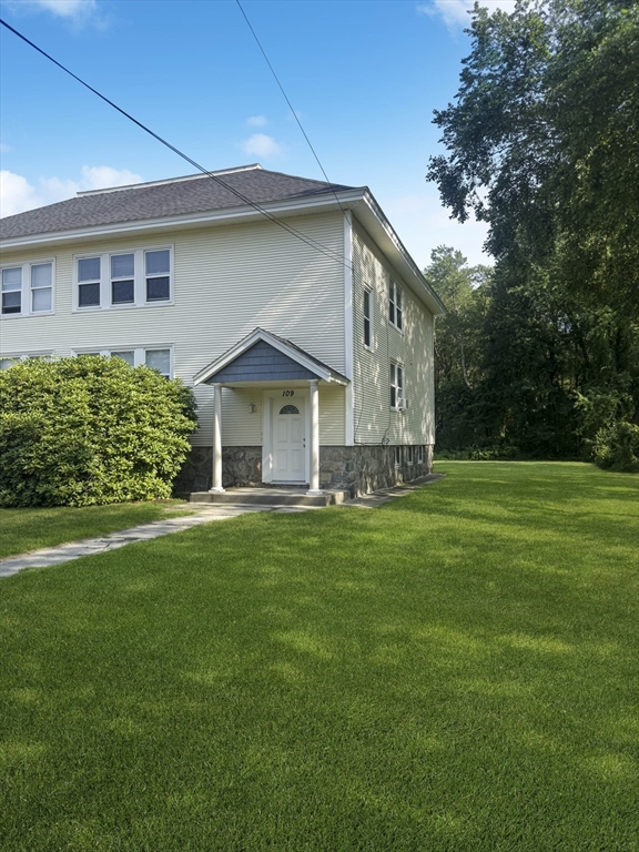 109 Hampshire Road, Unit 2 Methuen, MA 01844 - Photo 28 of 29 a front view of house with yard and green space