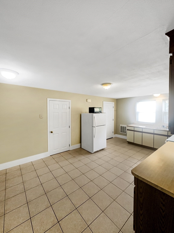 109 Hampshire Road, Unit 2 Methuen, MA 01844 - Photo 9 of 29 a view of a livingroom with furniture and window