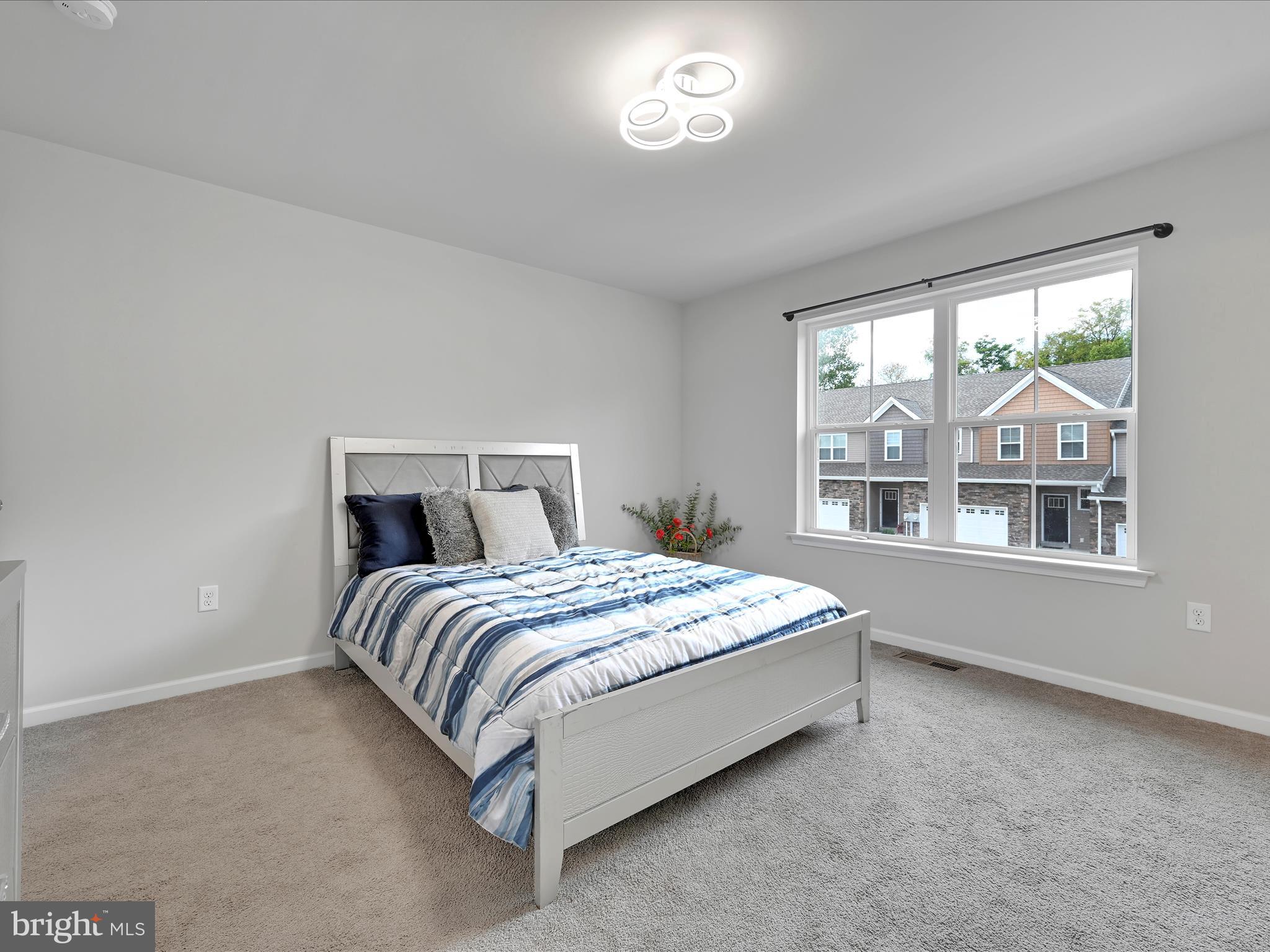 108 Staplehill Court Sinking Spring, PA 19608 - Photo 20 of 33 a bed sitting in a spacious bedroom next to a window