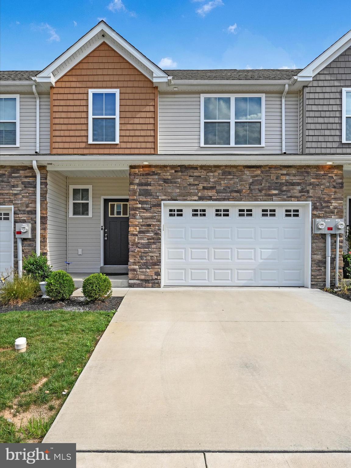 108 Staplehill Court Sinking Spring, PA 19608 - Photo 2 of 33 a front view of a house with a yard and garage
