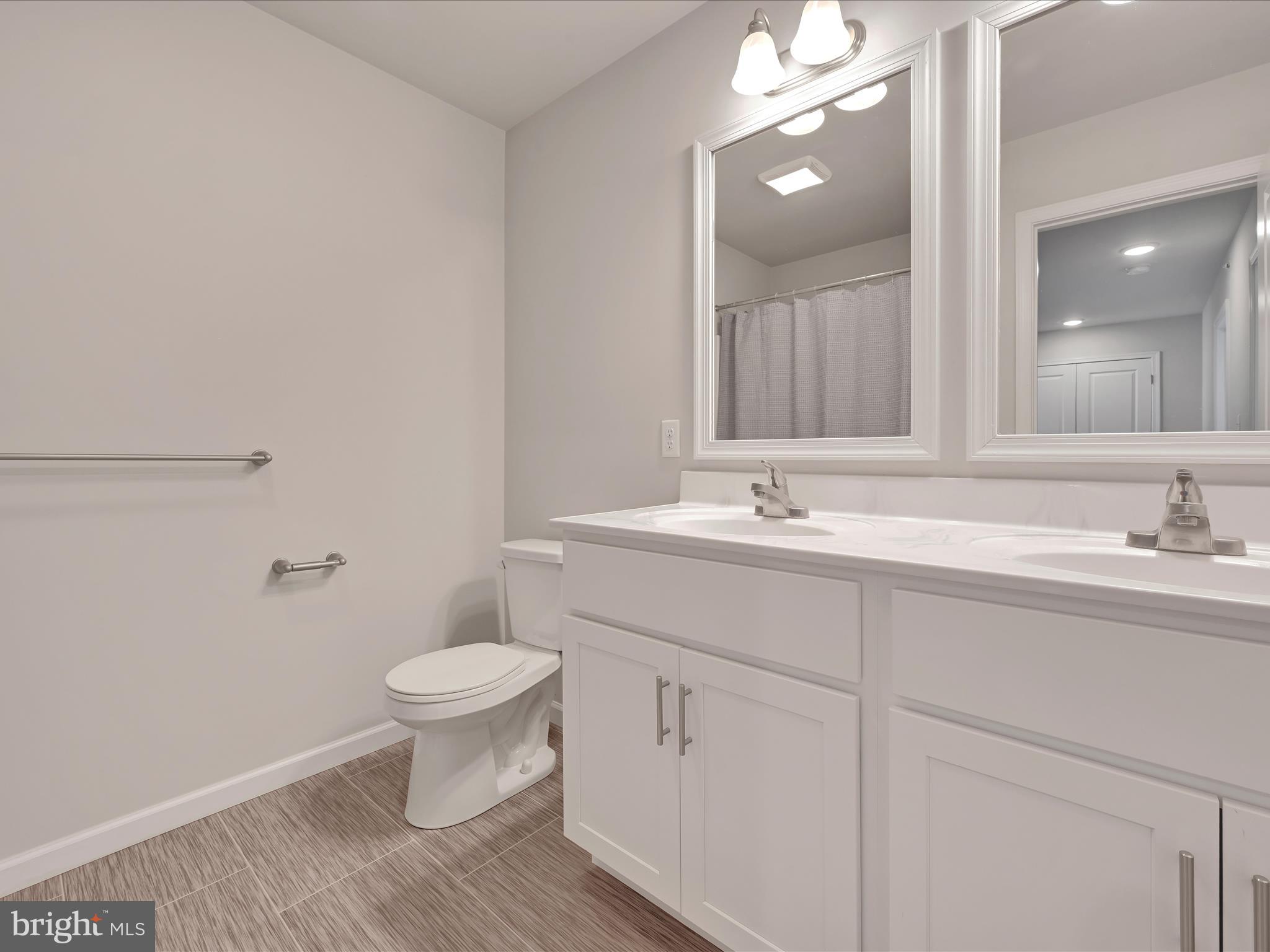 108 Staplehill Court Sinking Spring, PA 19608 - Photo 30 of 33 a bathroom with a sink and a mirror