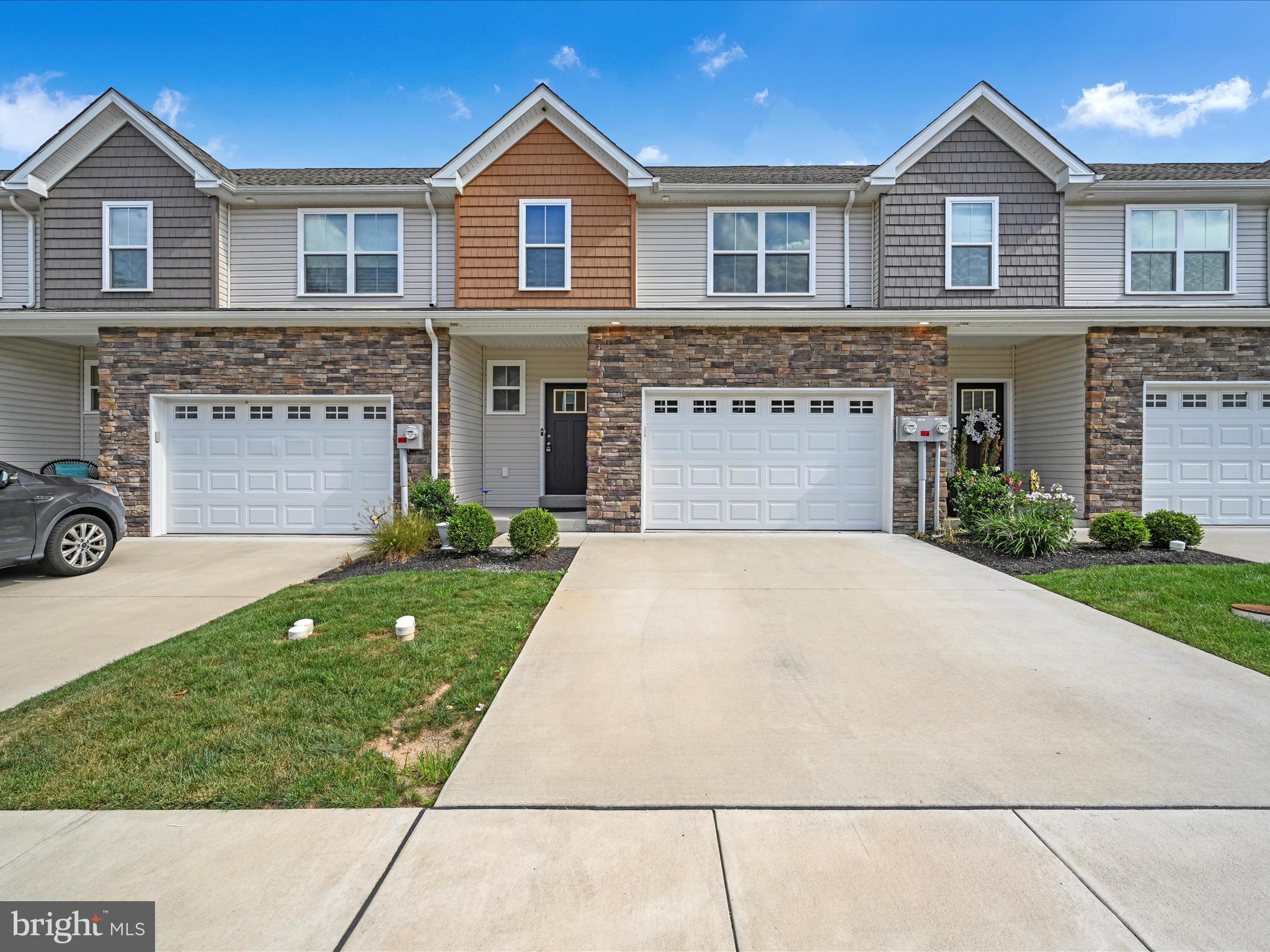 108 Staplehill Court Sinking Spring, PA 19608 - Photo 3 of 33 a front view of a house with a yard and garage