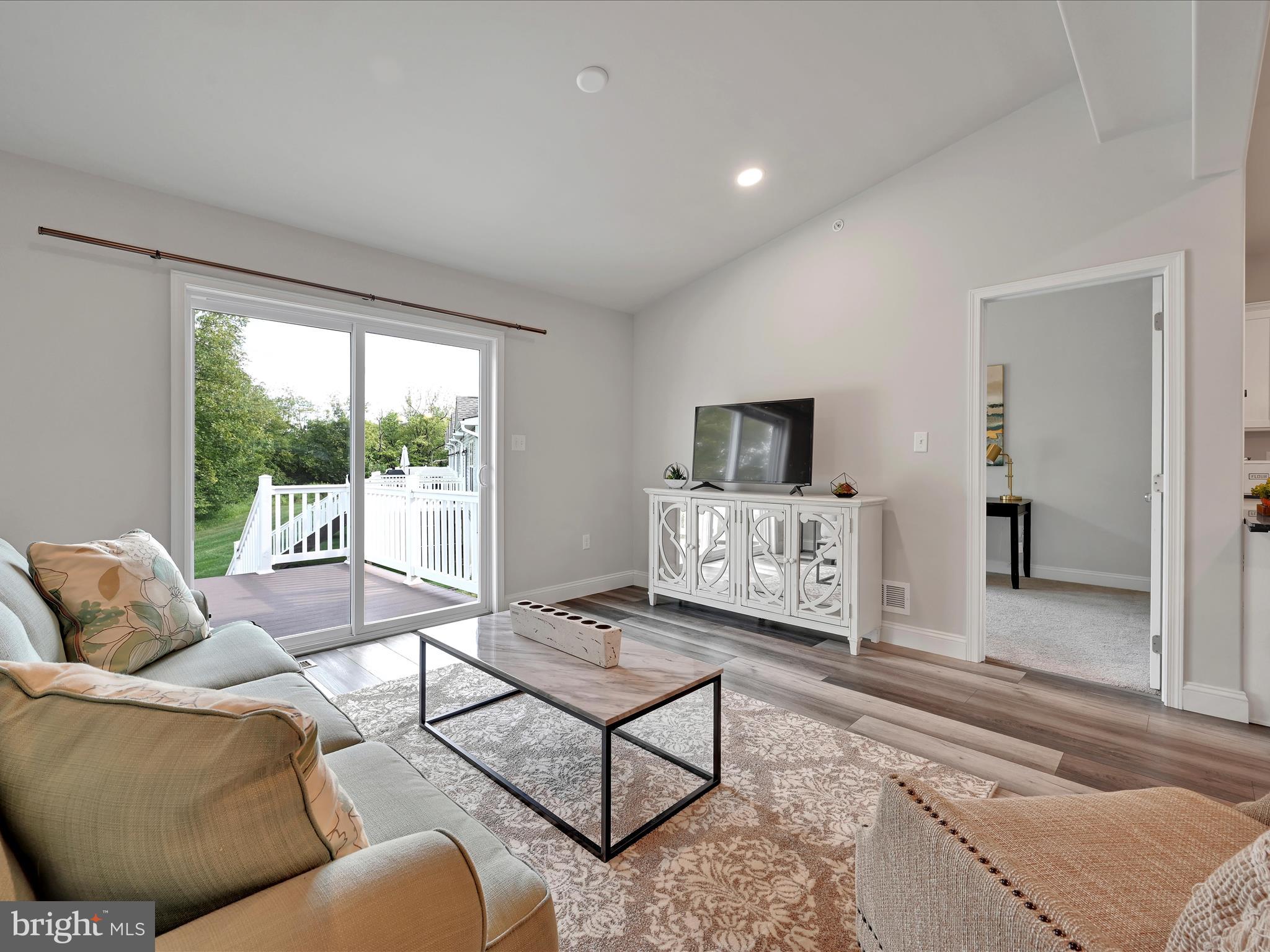 108 Staplehill Court Sinking Spring, PA 19608 - Photo 8 of 33 a living room with furniture and a floor to ceiling window