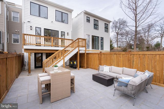 a view of a patio with a table and chairs