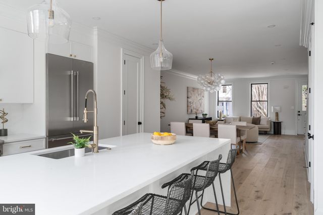a view of a dining room and livingroom with furniture